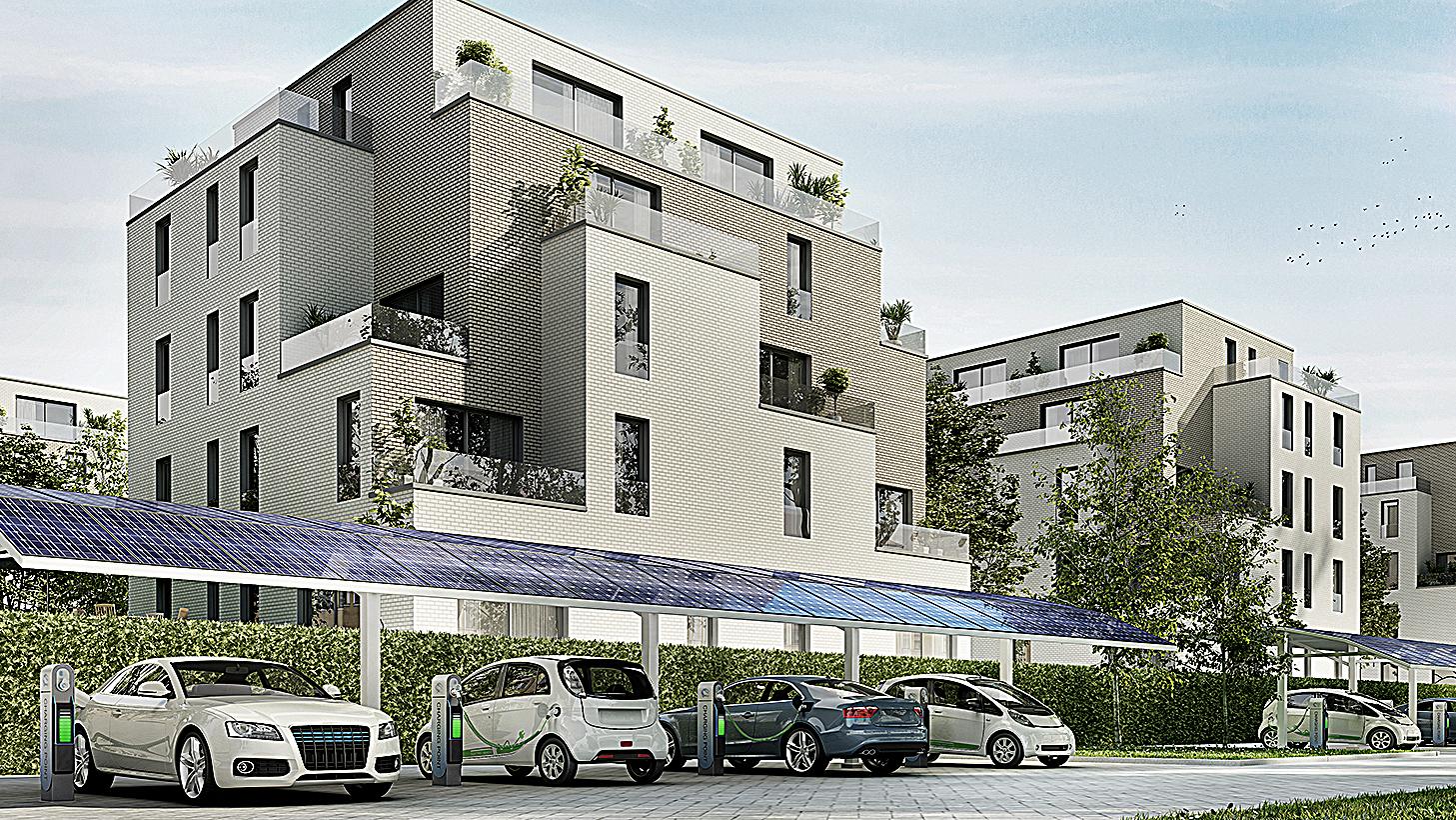 Bauen mit Energie. Modellansicht eines modernen, energieeffizienten Gebäudes. Vor dem Gebäude stehen Elektrofahrzeuge, die an Ladestationen angeschlossen sind unter einem PV-Carport.